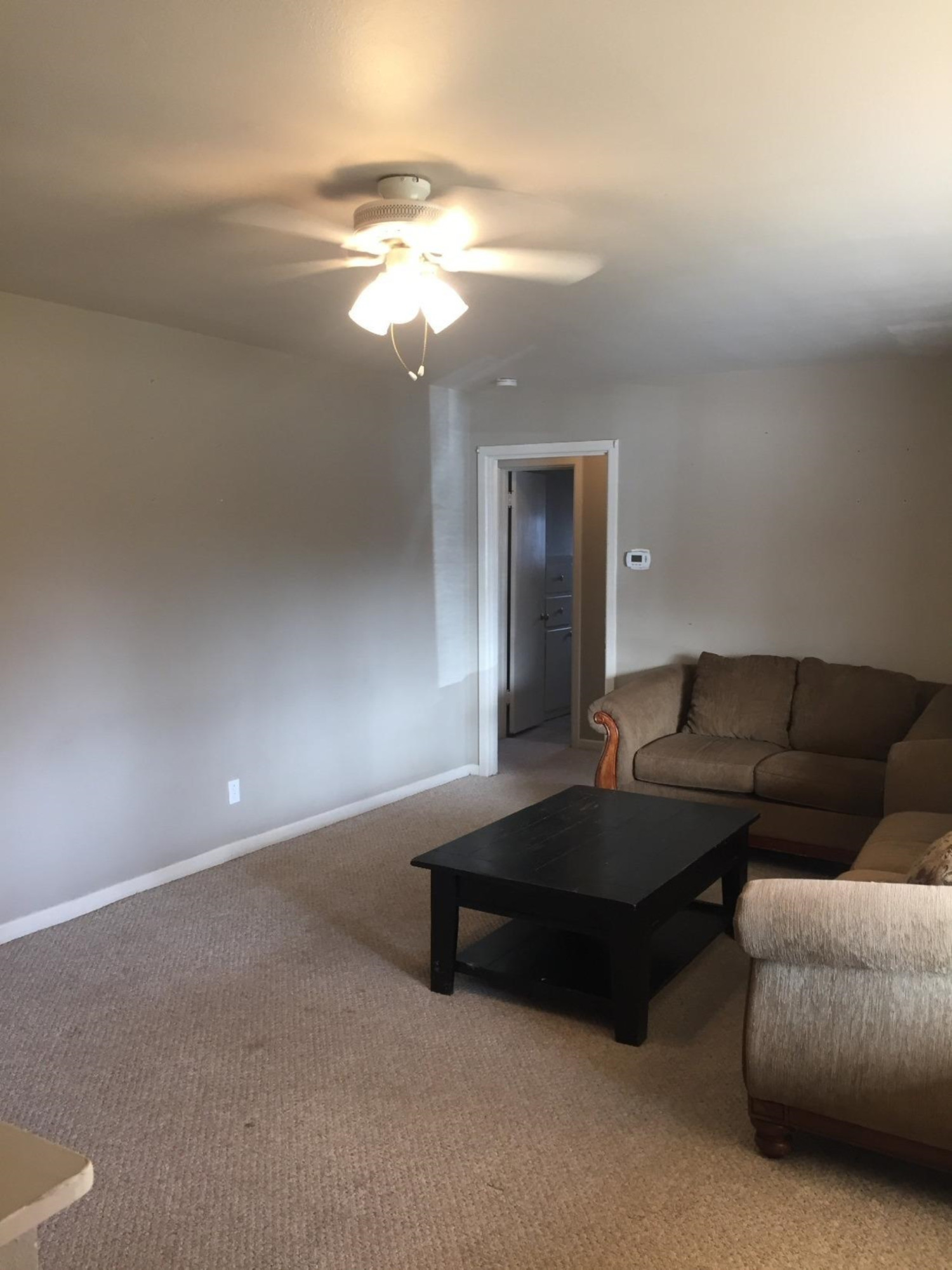 3216 36th Street Lubbock, TX 79413 - Photo 3 of 11 a living room with furniture and a chandelier