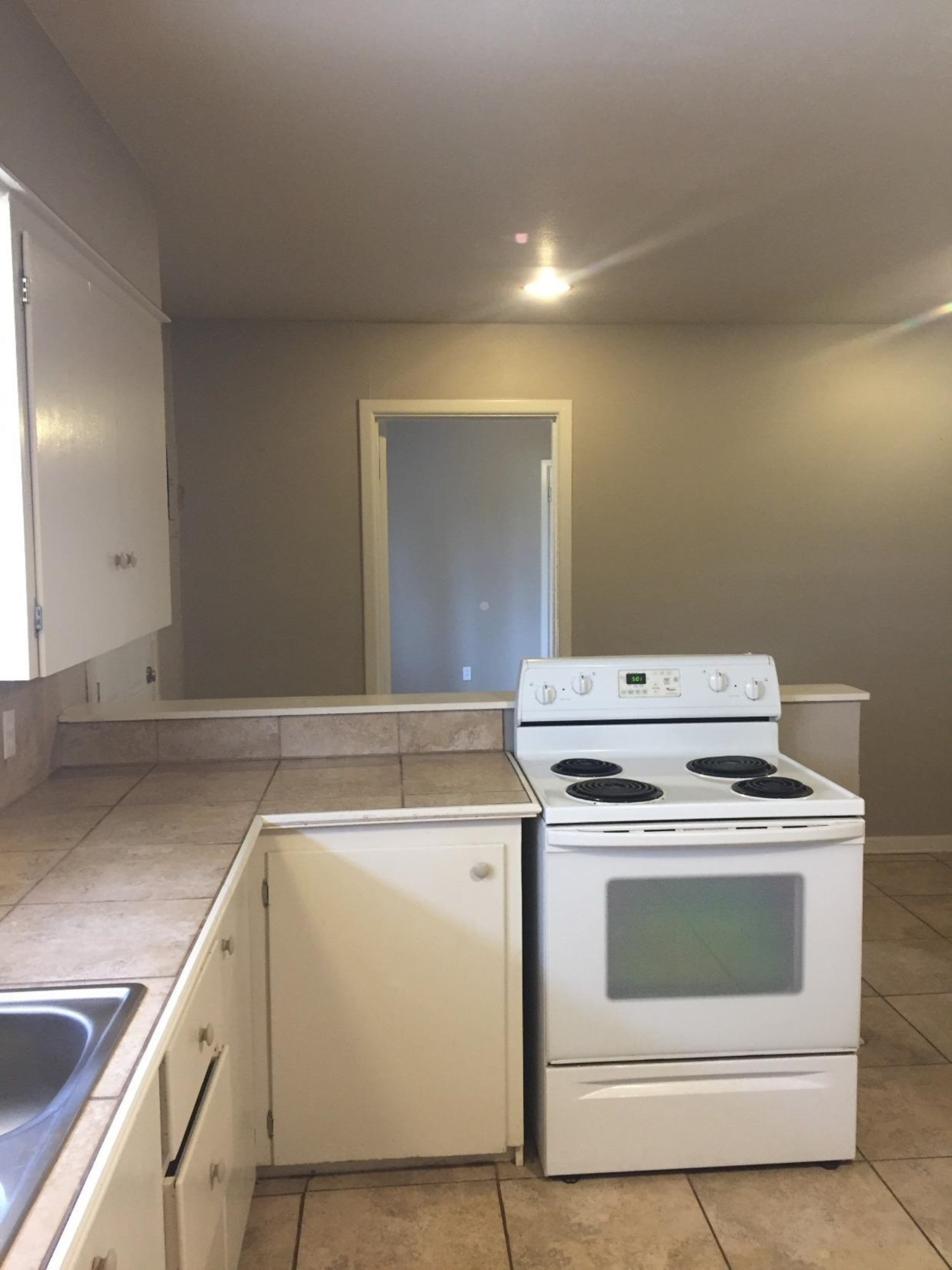 3216 36th Street Lubbock, TX 79413 - Photo 7 of 11 a utility room with dryer and washer