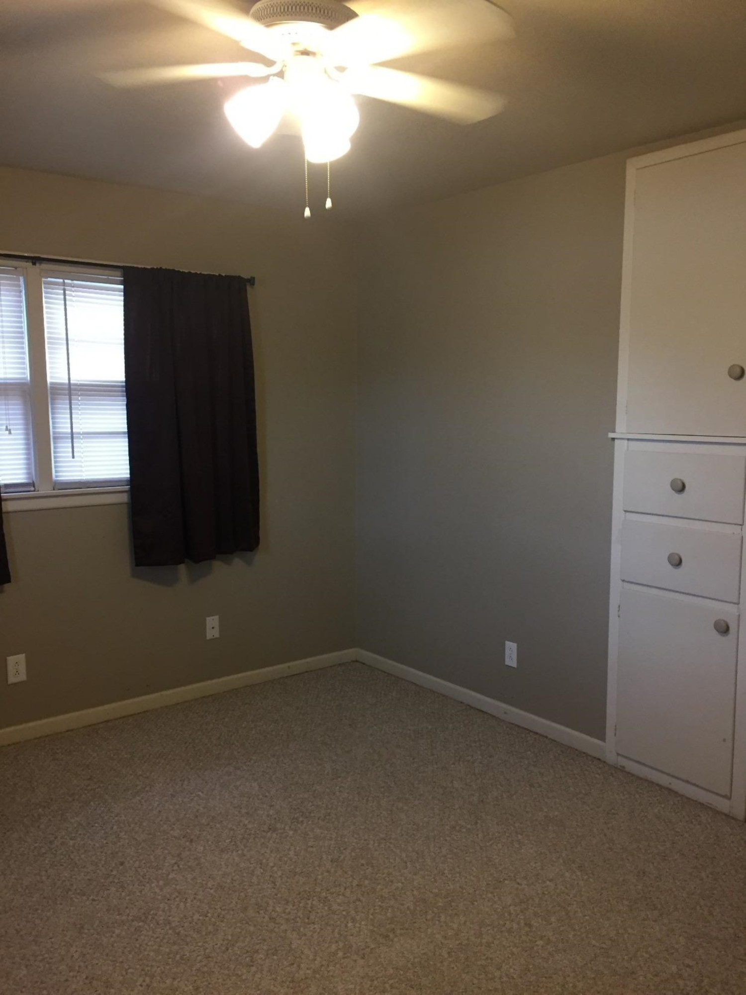 3216 36th Street Lubbock, TX 79413 - Photo 10 of 11 an empty room with a window