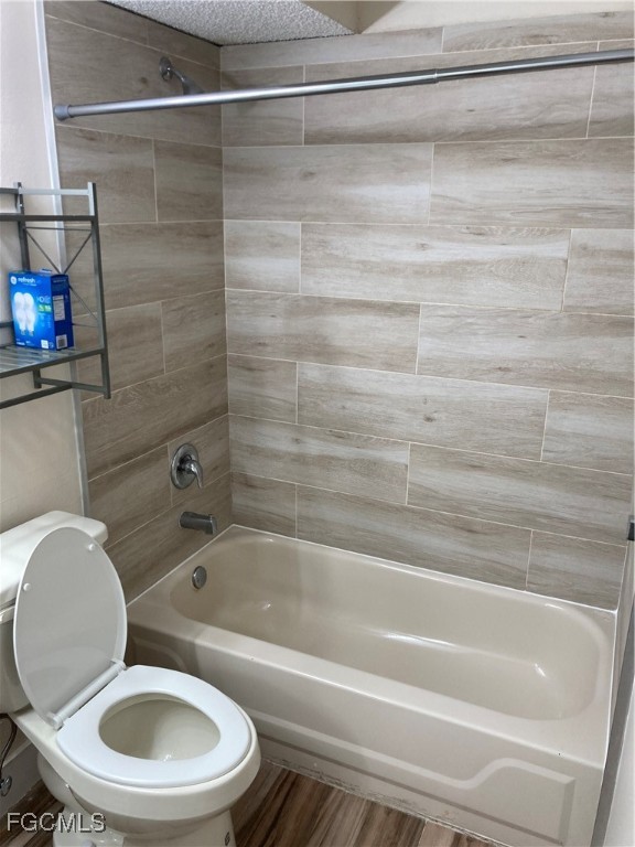 13521 Eagle Ridge Drive, Unit 128 Fort Myers, FL 33912 - Photo 10 of 11 a bathroom with a toilet and a bathtub