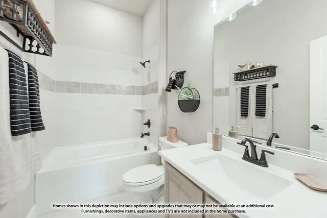 a bathroom with a toilet a sink and bathtub