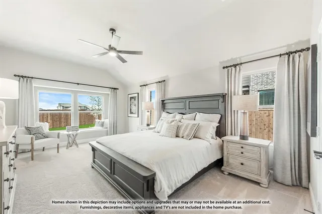 a bedroom with a large bed and a large window