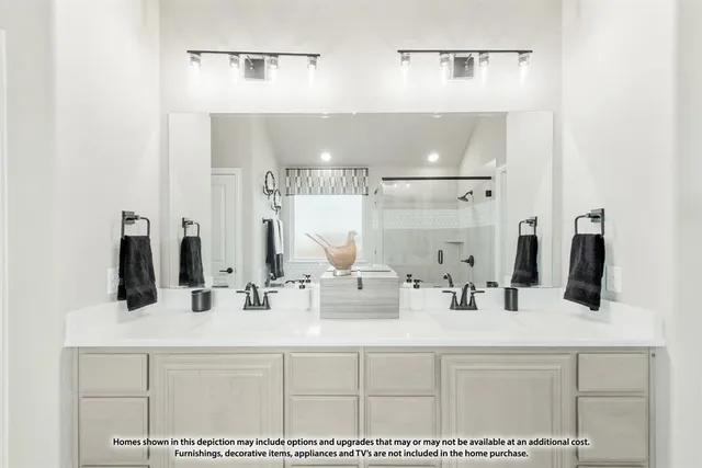 a bathroom with double vanity sink and a mirror