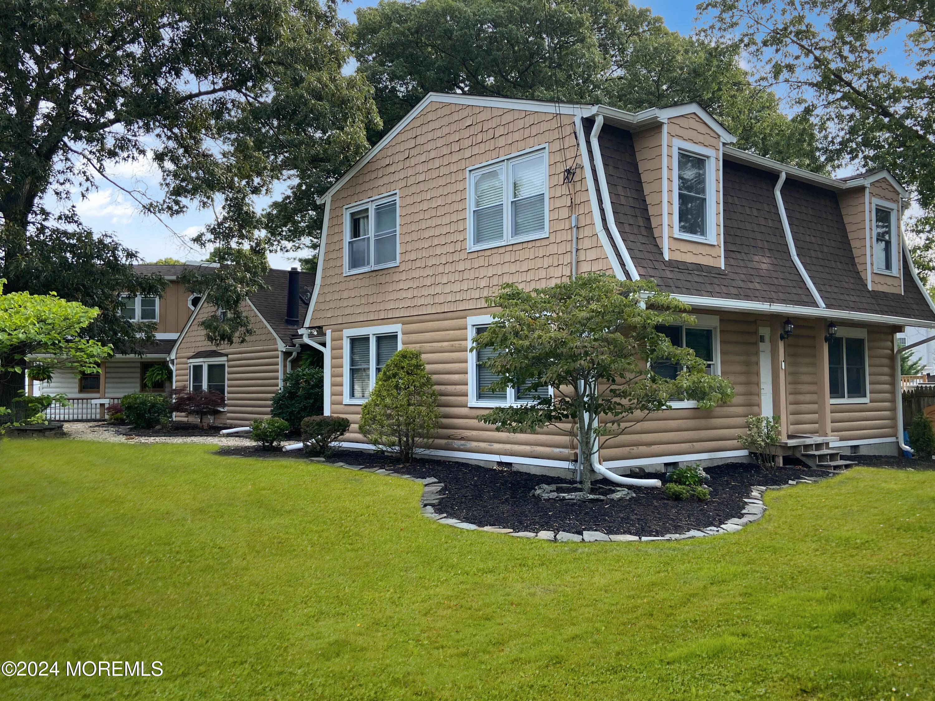 664 Carroll Fox Road Brick, NJ 08724 - Photo 5 of 63 a front view of a house with a yard