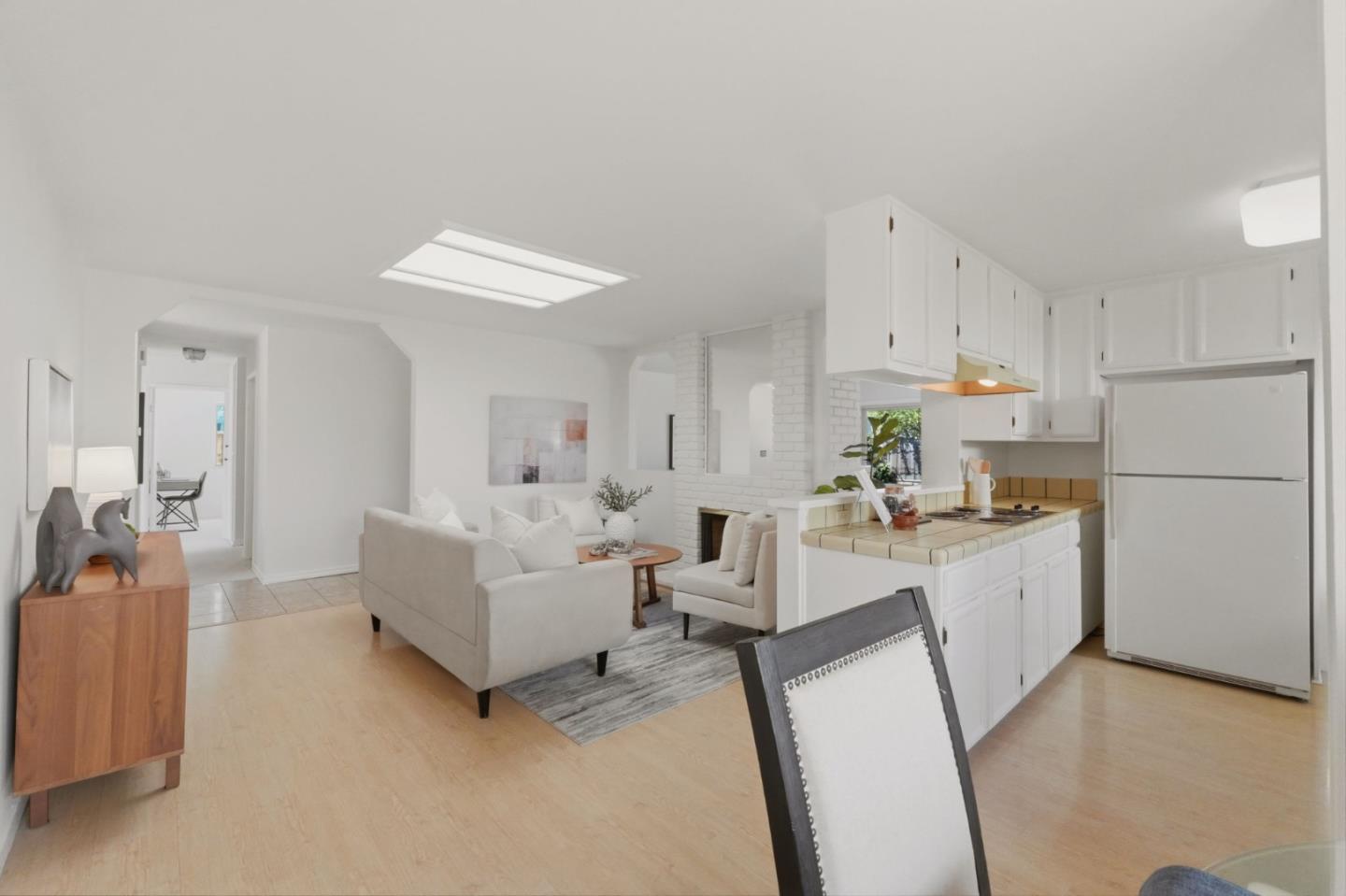 7577 Bollinger Road Cupertino, CA 95014 - Photo 11 of 56 a living room with stainless steel appliances furniture a rug and a kitchen view