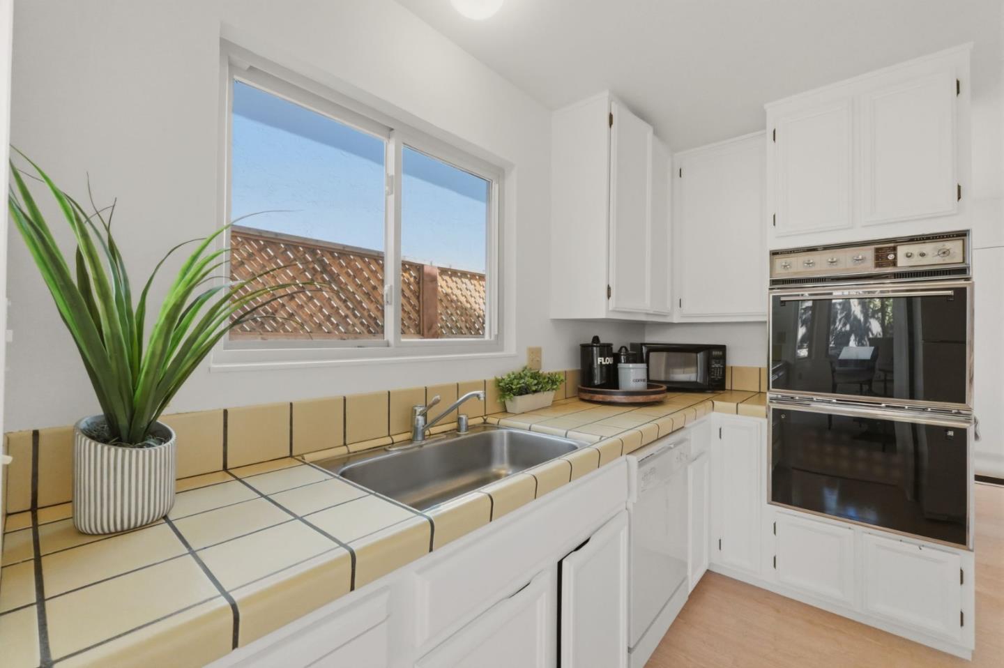 7577 Bollinger Road Cupertino, CA 95014 - Photo 17 of 56 a kitchen with stainless steel appliances a sink a stove and cabinets