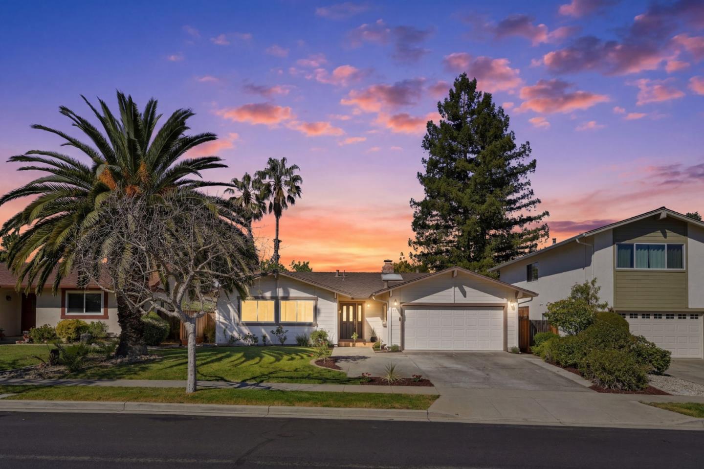 7577 Bollinger Road Cupertino, CA 95014 - Photo 2 of 56 a front view of a house with a garden and tree