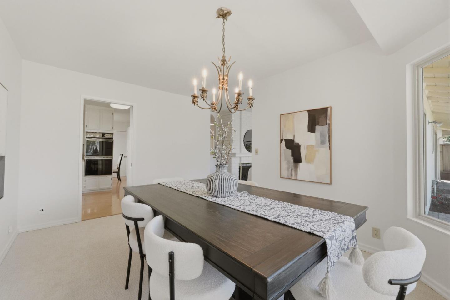 7577 Bollinger Road Cupertino, CA 95014 - Photo 21 of 56 a view of a dining room with furniture and chandelier