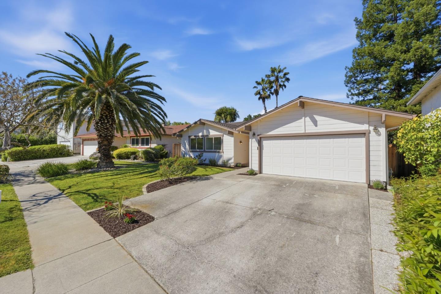 7577 Bollinger Road Cupertino, CA 95014 - Photo 3 of 56 a view of a house with a yard and palm trees