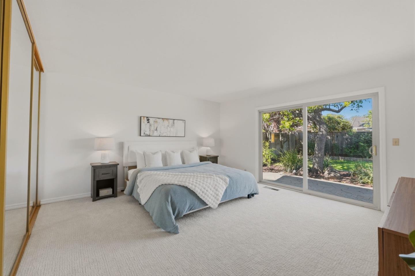 7577 Bollinger Road Cupertino, CA 95014 - Photo 31 of 56 a spacious bedroom with a balcony a bed and a large window