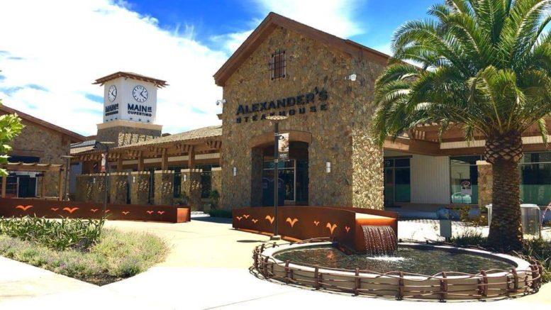 7577 Bollinger Road Cupertino, CA 95014 - Photo 52 of 56 a view of a brick house with a large windows and a yard