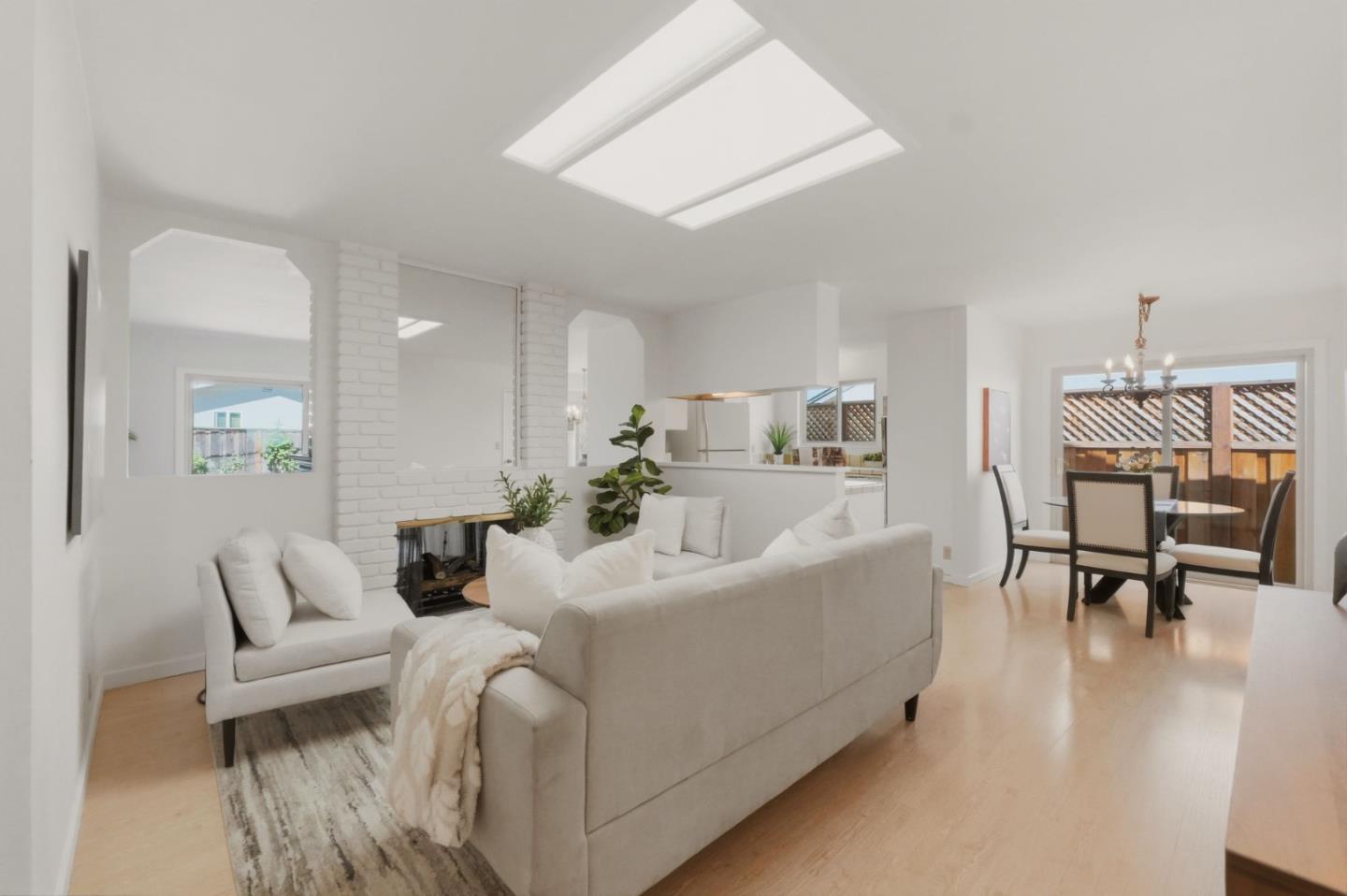 7577 Bollinger Road Cupertino, CA 95014 - Photo 7 of 56 a living room with furniture and a dining table with kitchen view