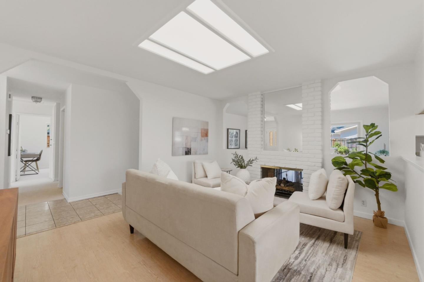 7577 Bollinger Road Cupertino, CA 95014 - Photo 9 of 56 a living room with furniture and a potted plant