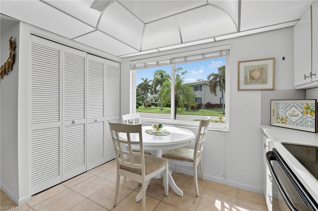 219 Memory Lane, Unit 3 Naples, FL 34112 - Photo 21 of 35 Kitchen with Washer Dryer in closet