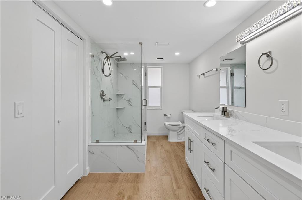 Brand new master bathroom with double sinks and recessed lighting