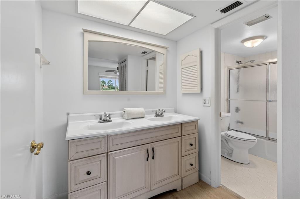 219 Memory Lane, Unit 3 Naples, FL 34112 - Photo 9 of 35 Bathroom number 2 with large vanity
