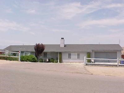 16580 El Evado Road Victorville, CA 92394 - Photo 1 of 1 a front view of a house with a yard