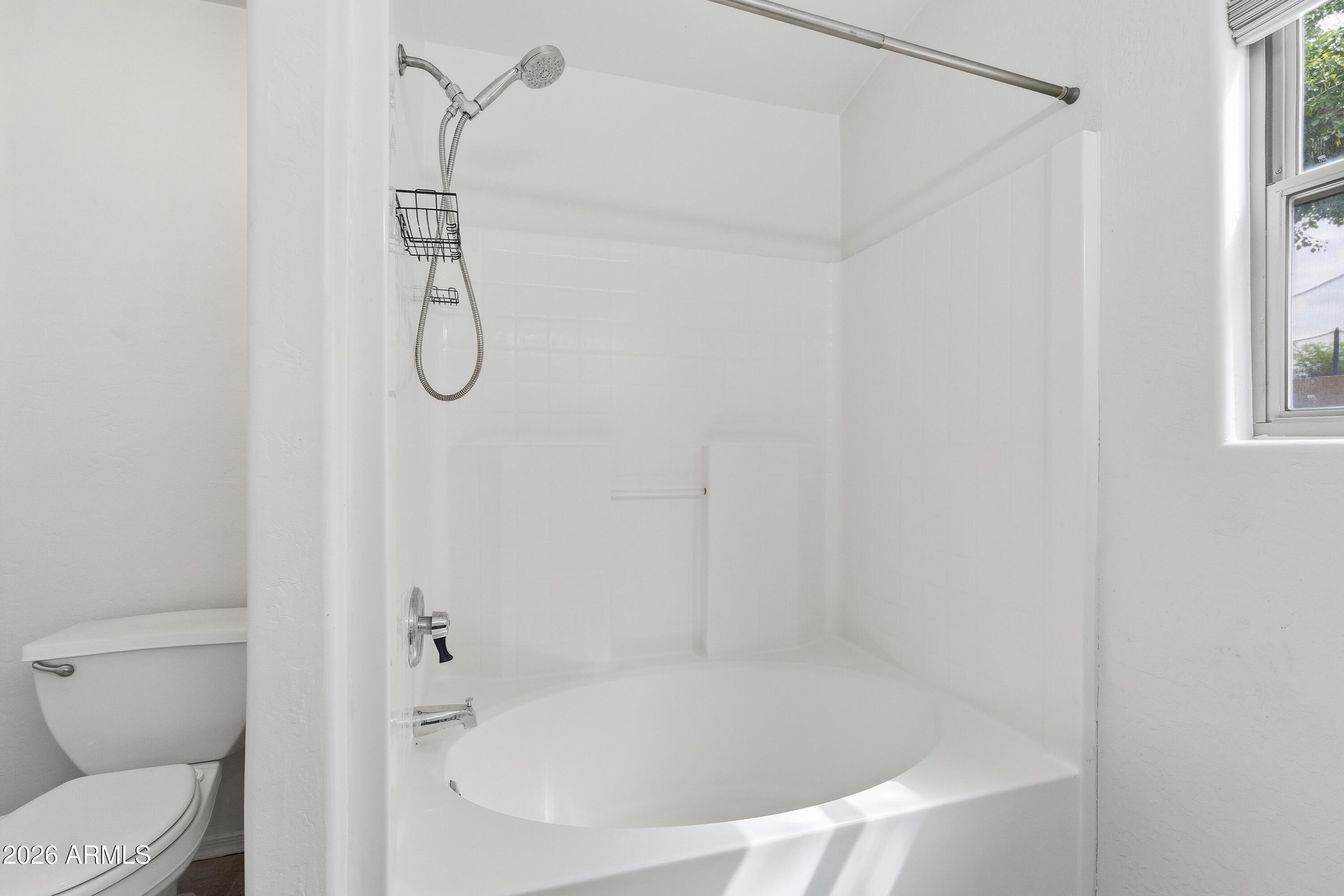 3242 East Bonanza Road Gilbert, AZ 85297 - Photo 25 of 36 a bathroom with a bath tub with a shower