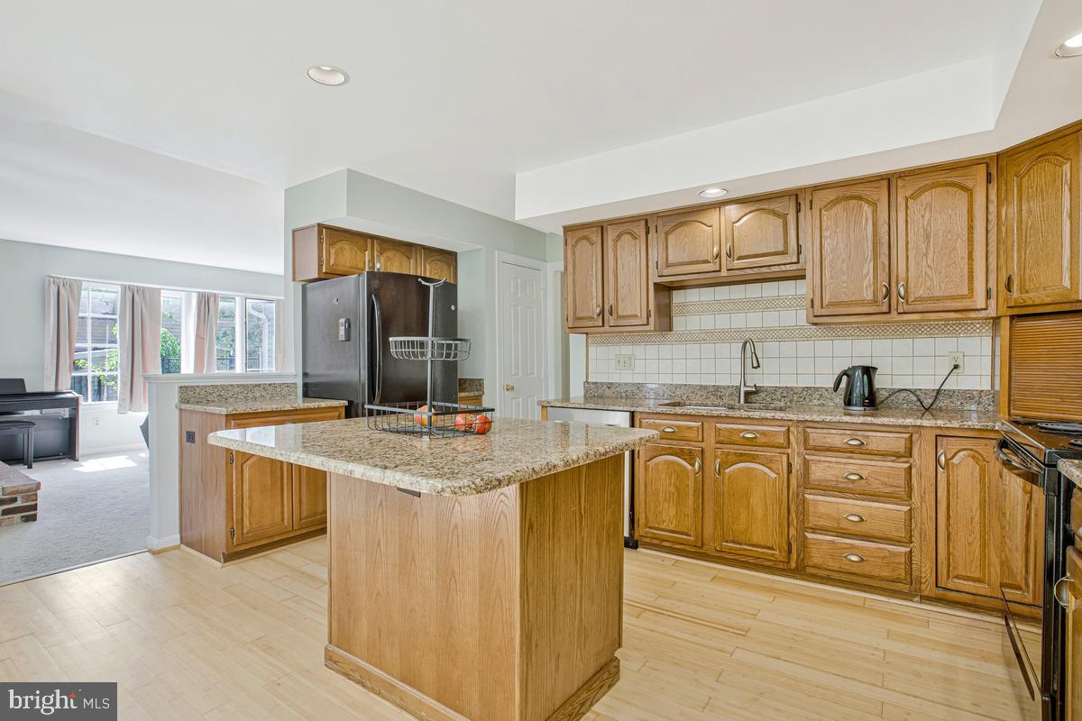 16311 Dahl Road Laurel, MD 20707 - Photo 16 of 54 Spacious kitchen with elegant finishes.