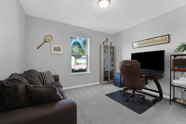 a living room with furniture and a window
