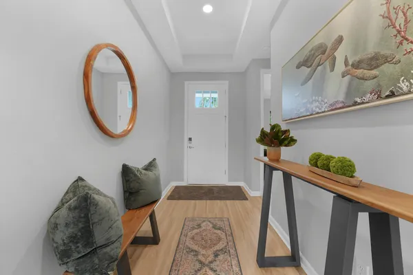 a view of entryway with wooden floor
