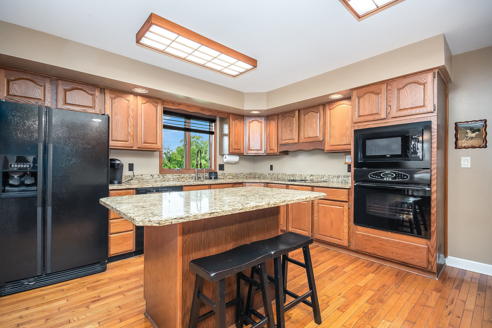 44W601 Ellithorpe Road Elgin, IL 60124 - Photo 16 of 32 a kitchen with stainless steel appliances granite countertop a window a refrigerator and a stove top oven