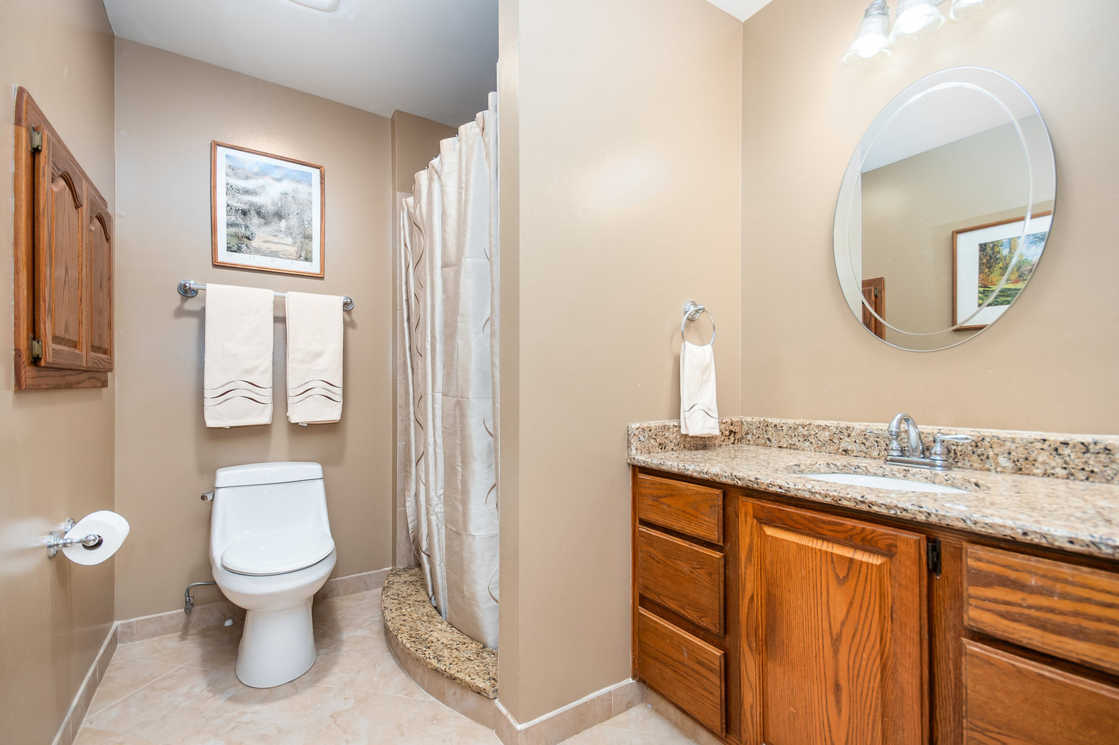 44W601 Ellithorpe Road Elgin, IL 60124 - Photo 20 of 32 a bathroom with a granite countertop toilet sink and mirror