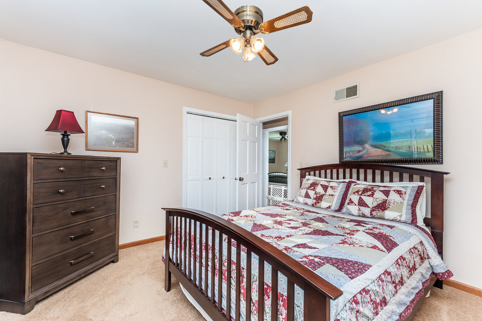44W601 Ellithorpe Road Elgin, IL 60124 - Photo 21 of 32 a bedroom with a bed and a chandelier