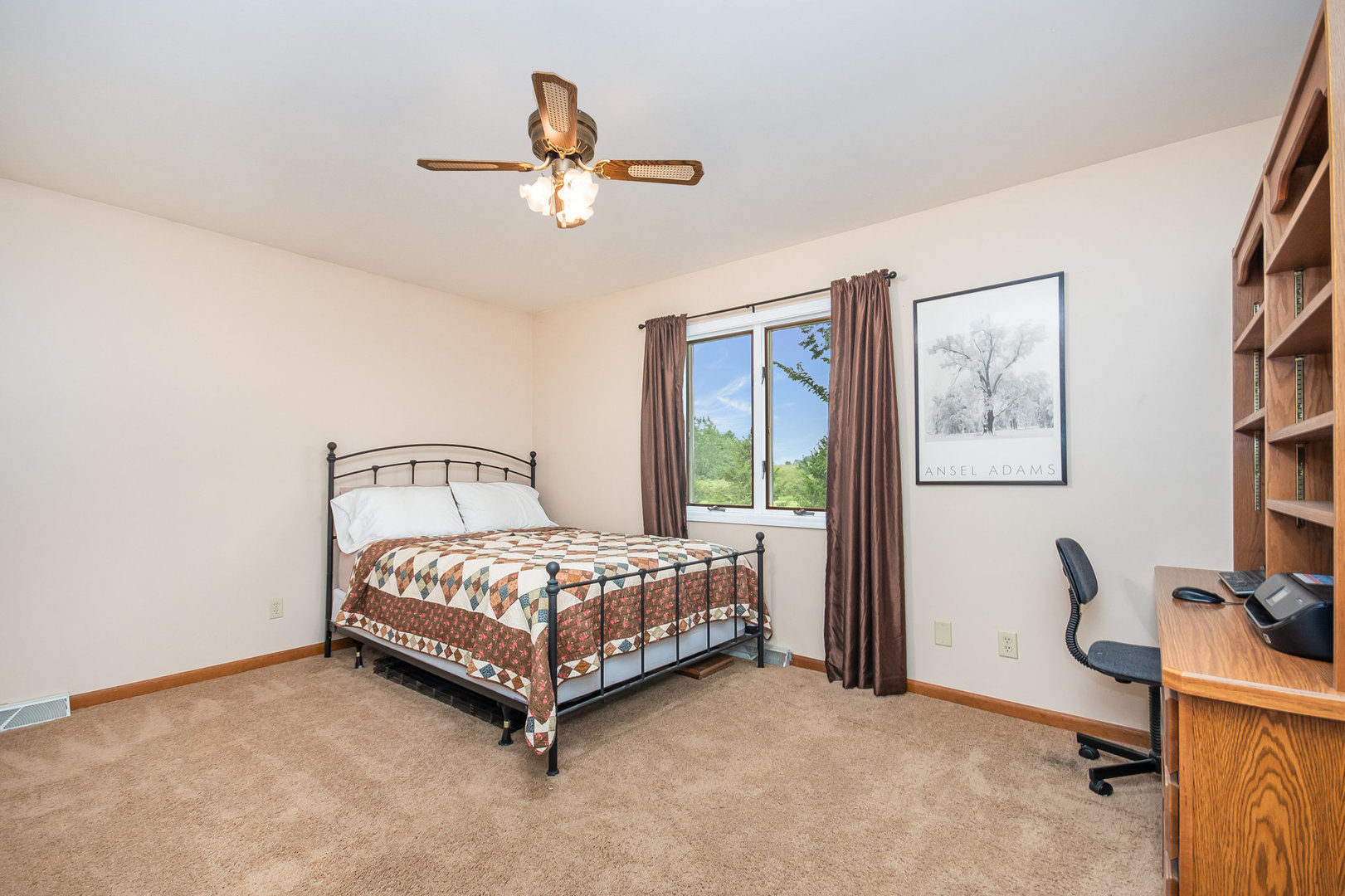 44W601 Ellithorpe Road Elgin, IL 60124 - Photo 22 of 32 a bedroom with a bed and a chandelier