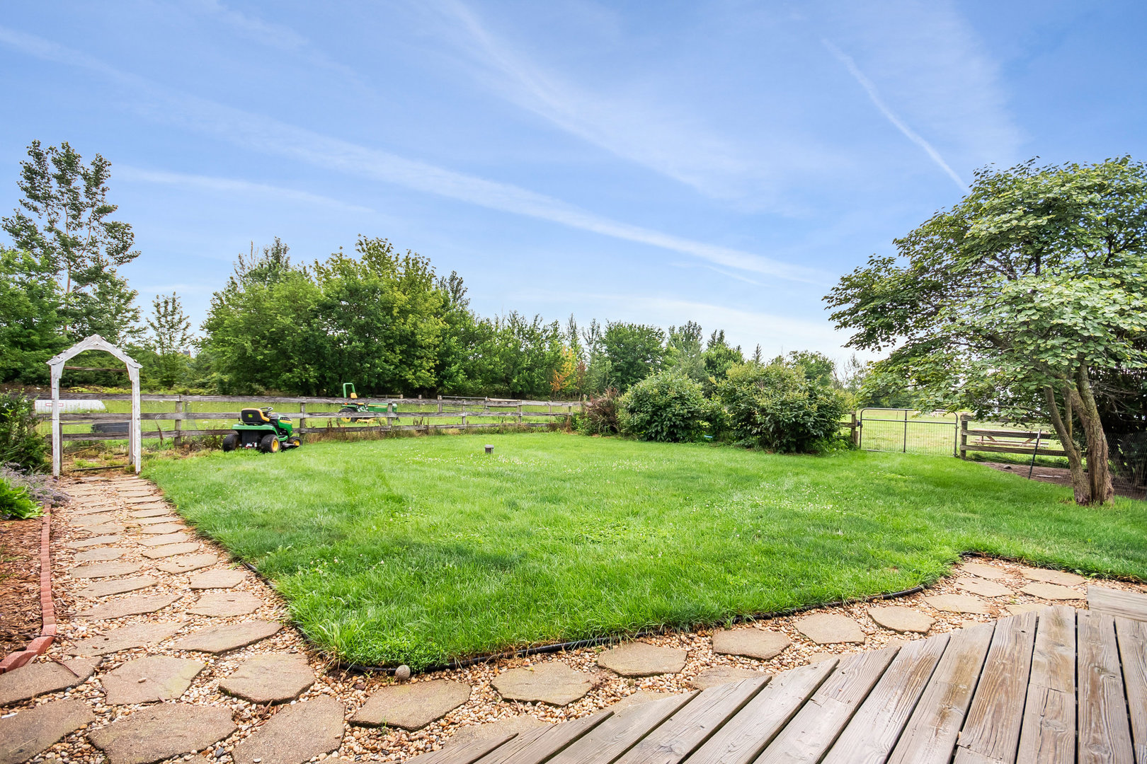 44W601 Ellithorpe Road Elgin, IL 60124 - Photo 26 of 32 a view of a backyard with potted plants and a large tree