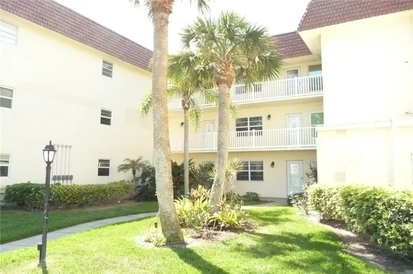 a view of a big yard in front of a building