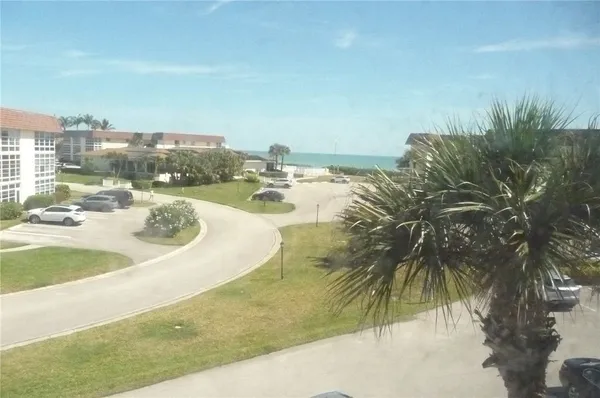 a view of a swimming pool with a yard