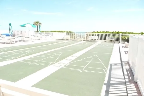 a view of a balcony with wooden floor