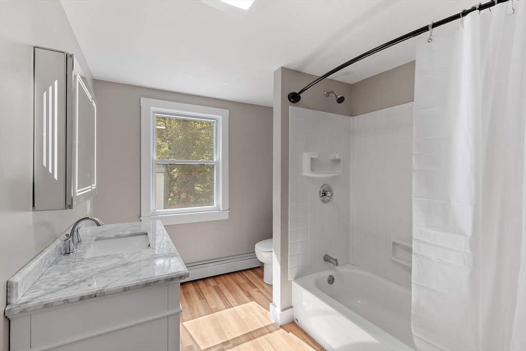 34 Morse Road Royalston, MA 01368 - Photo 23 of 42 a bathroom with a granite countertop sink toilet and shower
