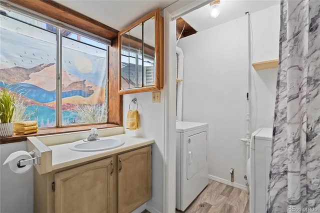 a bathroom with a sink and a window