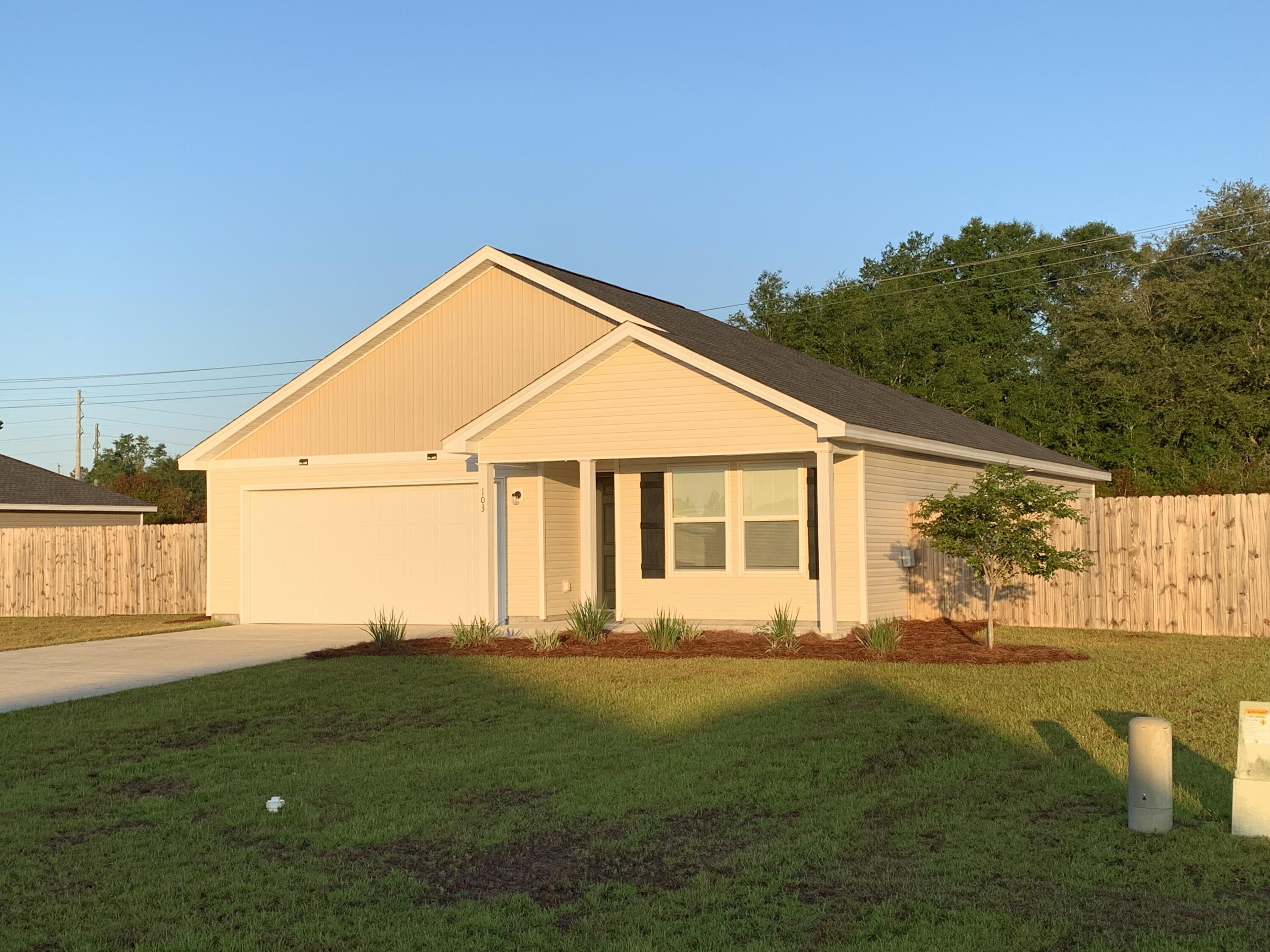 103 Cora Road DeFuniak Springs, FL 32433 - Photo 12 of 72 a front view of house with yard and green space