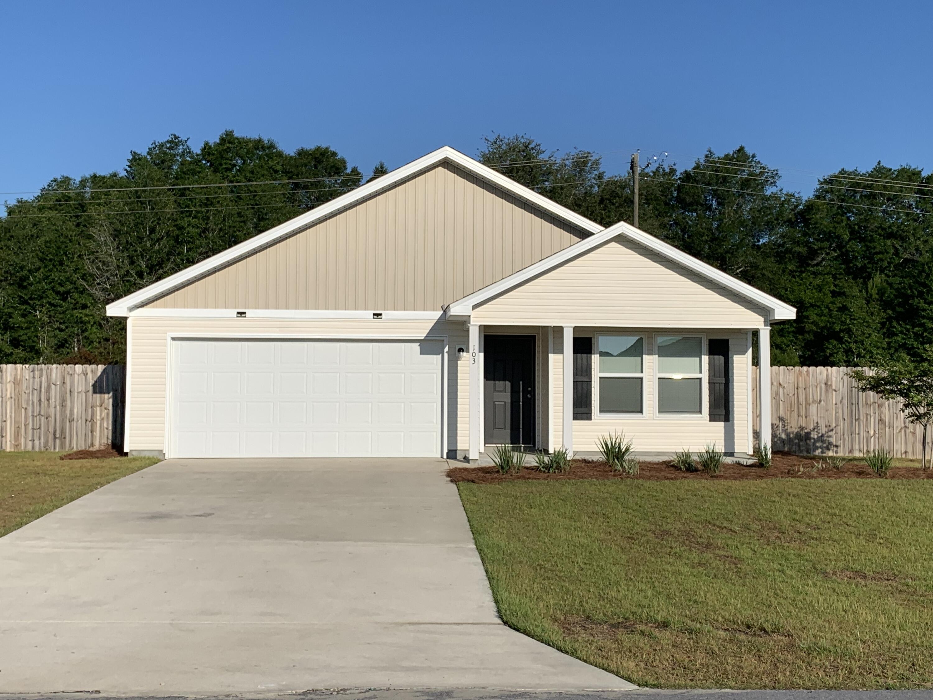 103 Cora Road DeFuniak Springs, FL 32433 - Photo 17 of 72 a front view of a house with a yard