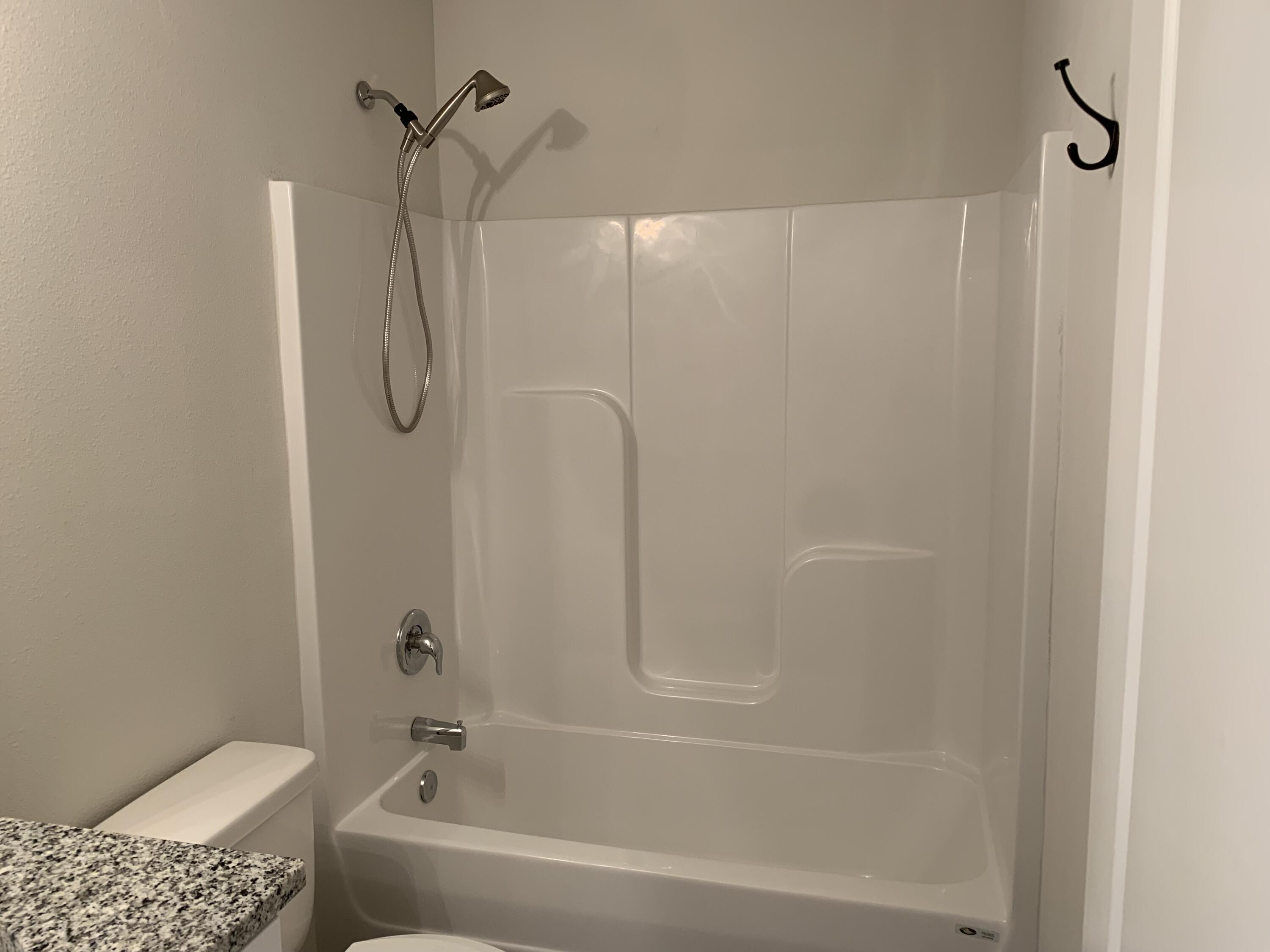 103 Cora Road DeFuniak Springs, FL 32433 - Photo 29 of 72 a bathroom with a shower and a toilet