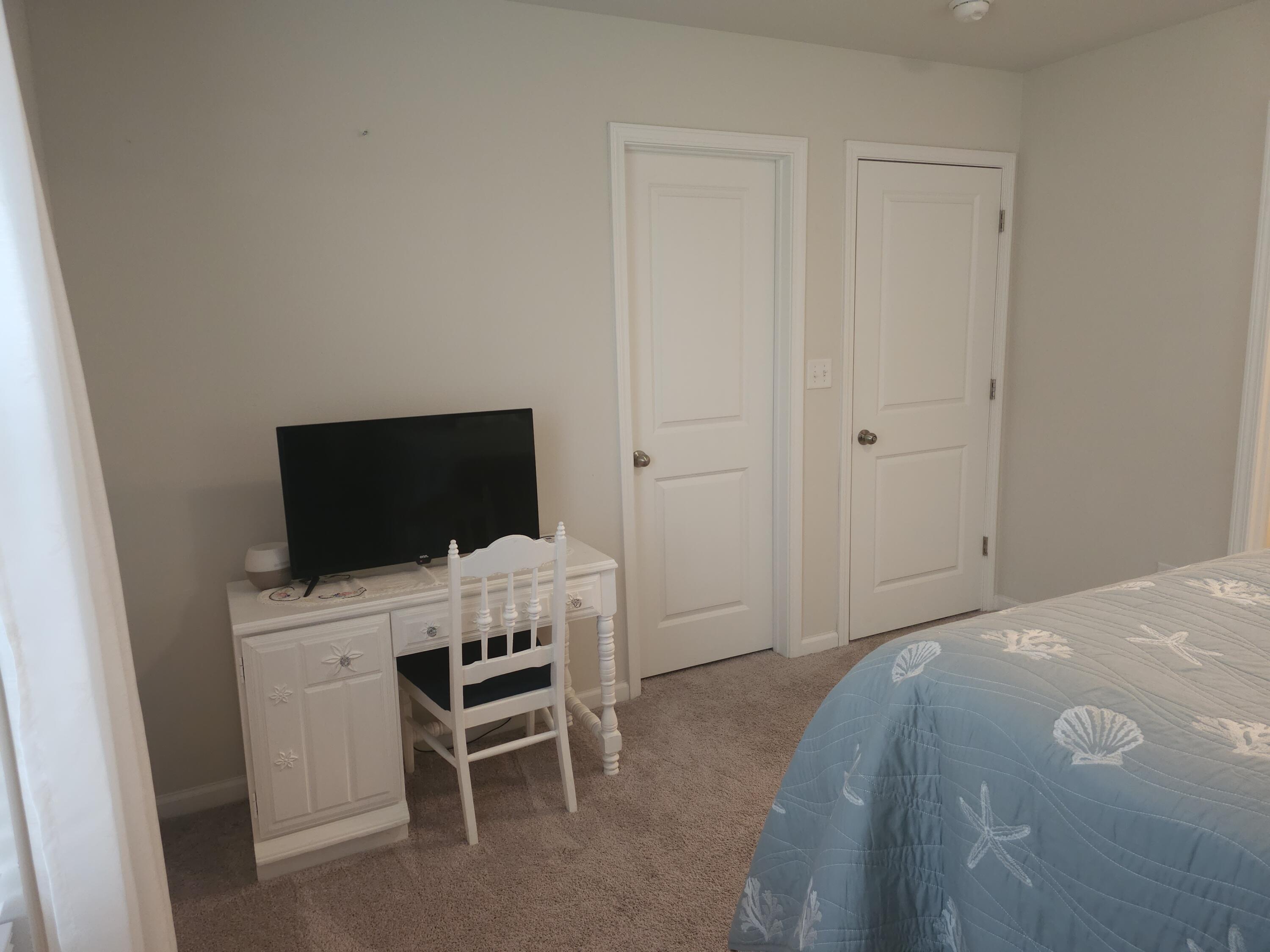 103 Cora Road DeFuniak Springs, FL 32433 - Photo 66 of 72 a bedroom with a bed and a flat screen tv