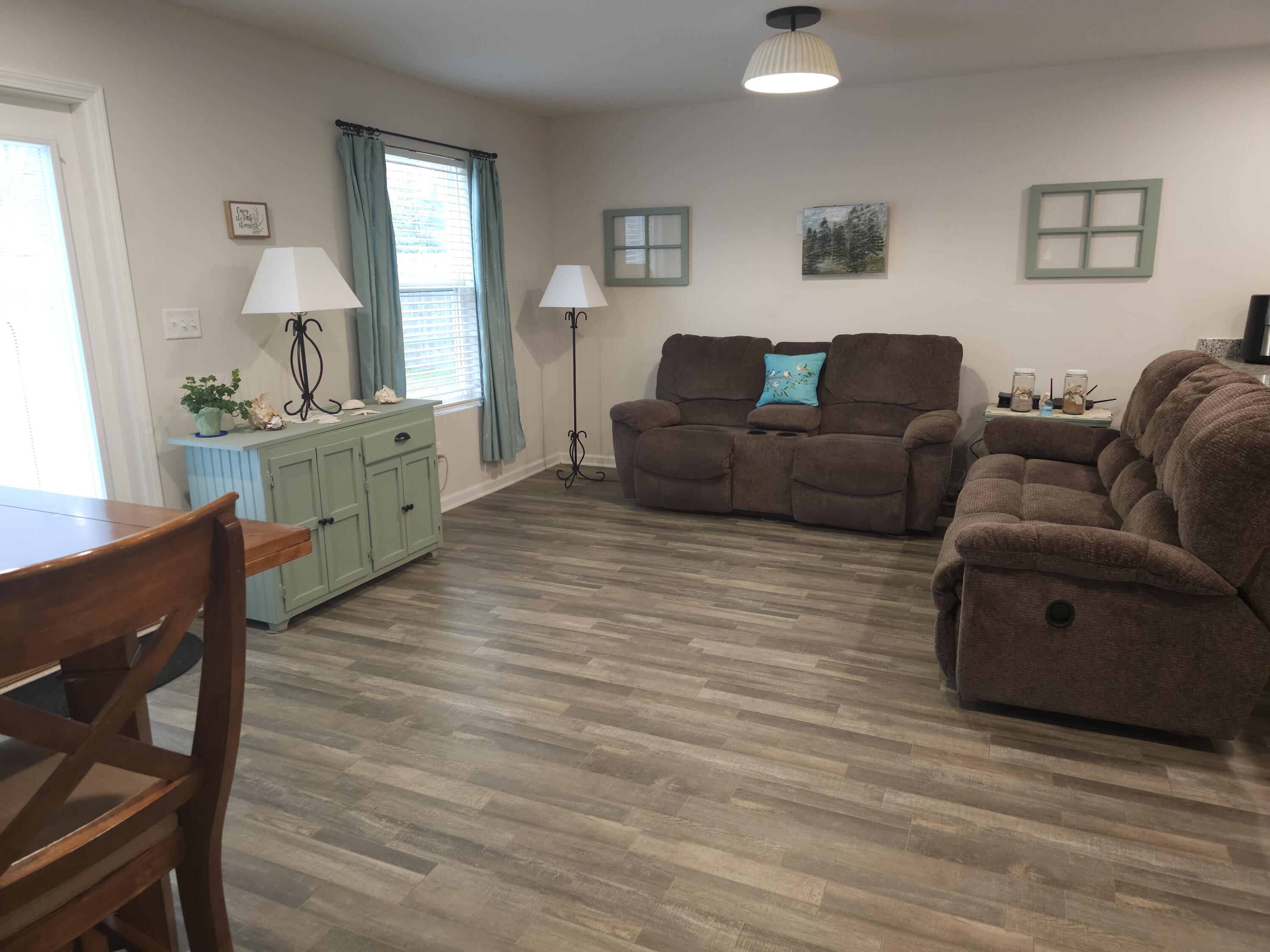103 Cora Road DeFuniak Springs, FL 32433 - Photo 69 of 72 a living room with furniture and a wooden floor