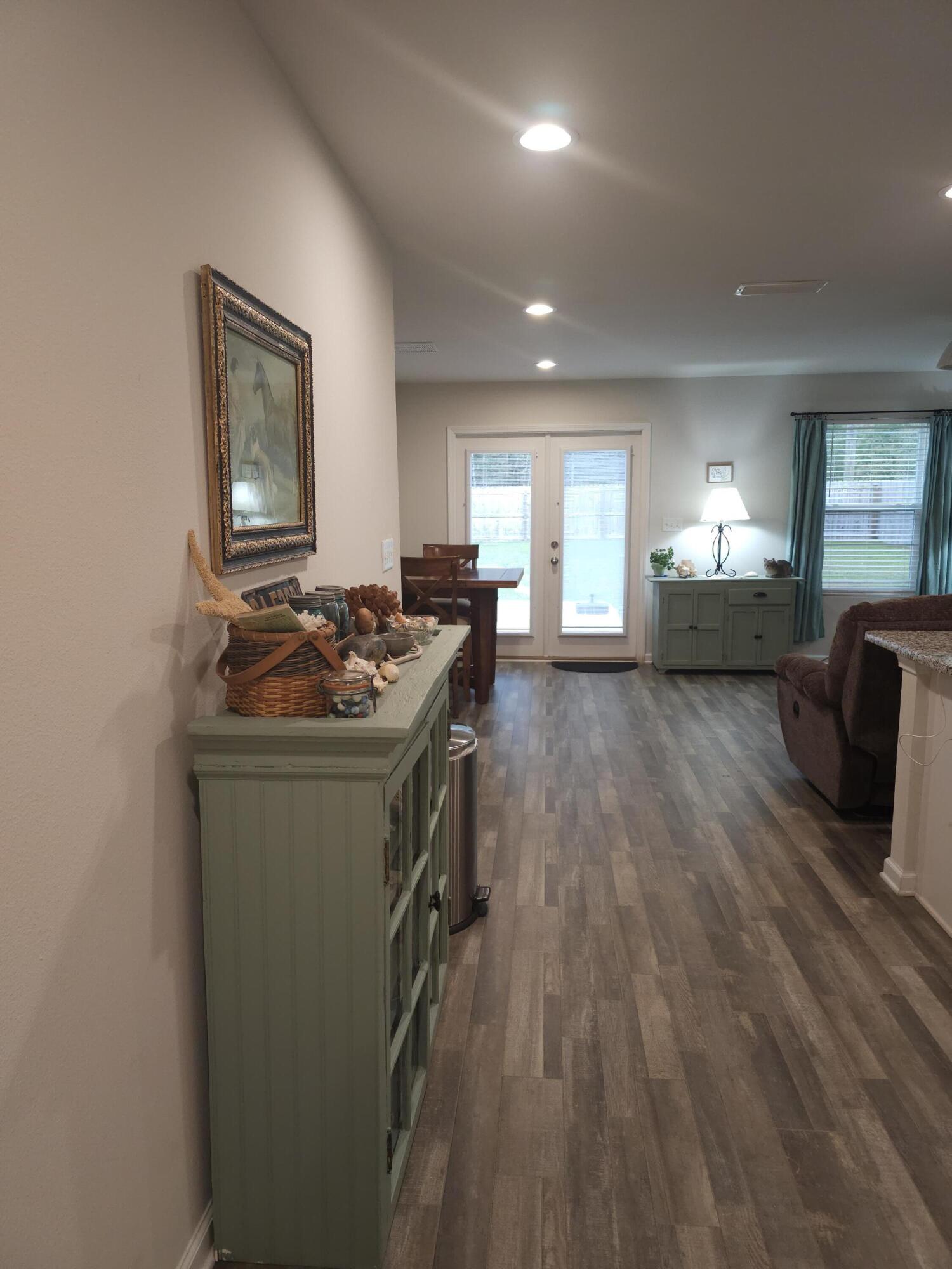 103 Cora Road DeFuniak Springs, FL 32433 - Photo 71 of 72 a kitchen with sink cabinets and wooden floor