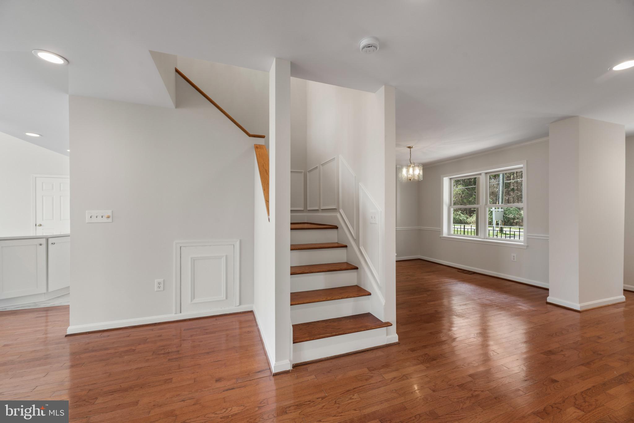 5929 Deale Beach Road Deale, MD 20751 - Photo 20 of 58 Stairway featuring hardwood / wood-style floors an
