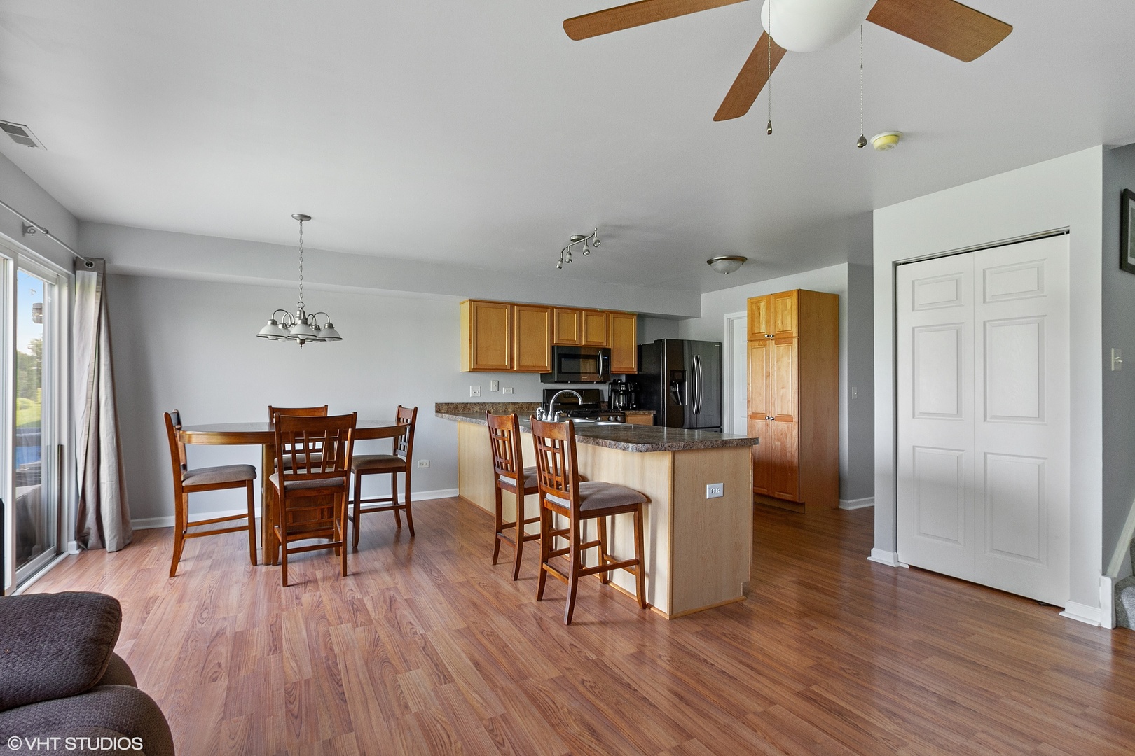 25109 Faraday Road Manhattan, IL 60442 - Photo 2 of 12 a view of a dining room with furniture and wooden floor