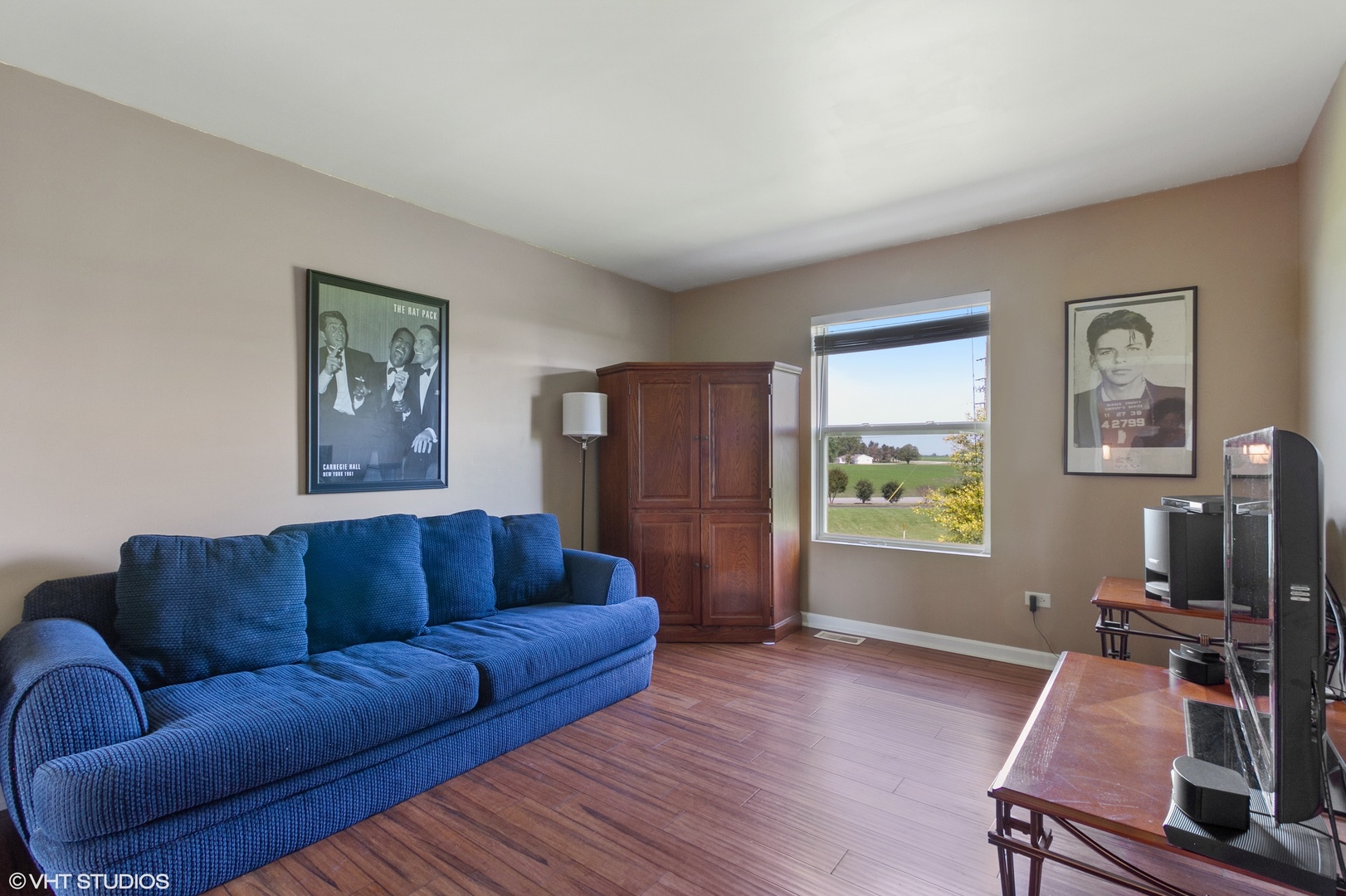 25109 Faraday Road Manhattan, IL 60442 - Photo 8 of 12 a living room with furniture and a flat screen tv