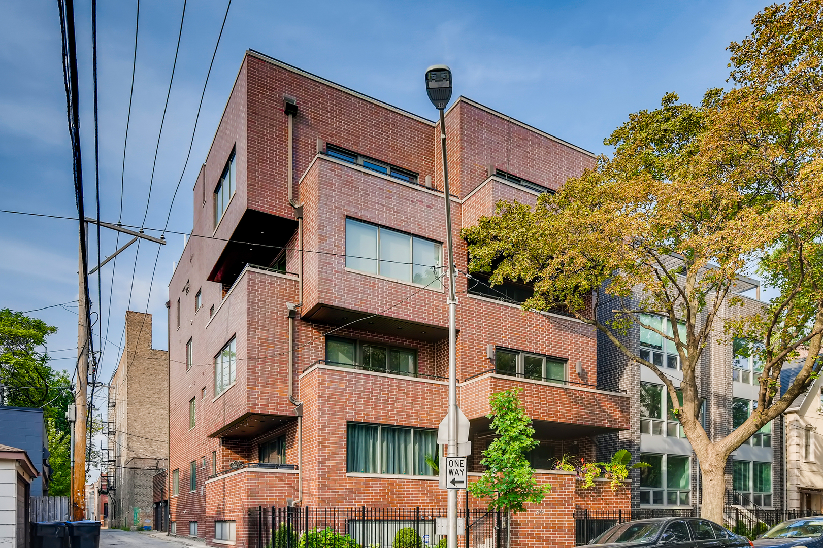 2144 West Rice Street, Unit 1E Chicago, IL 60622 - Photo 1 of 20 a front view of a building with a tree