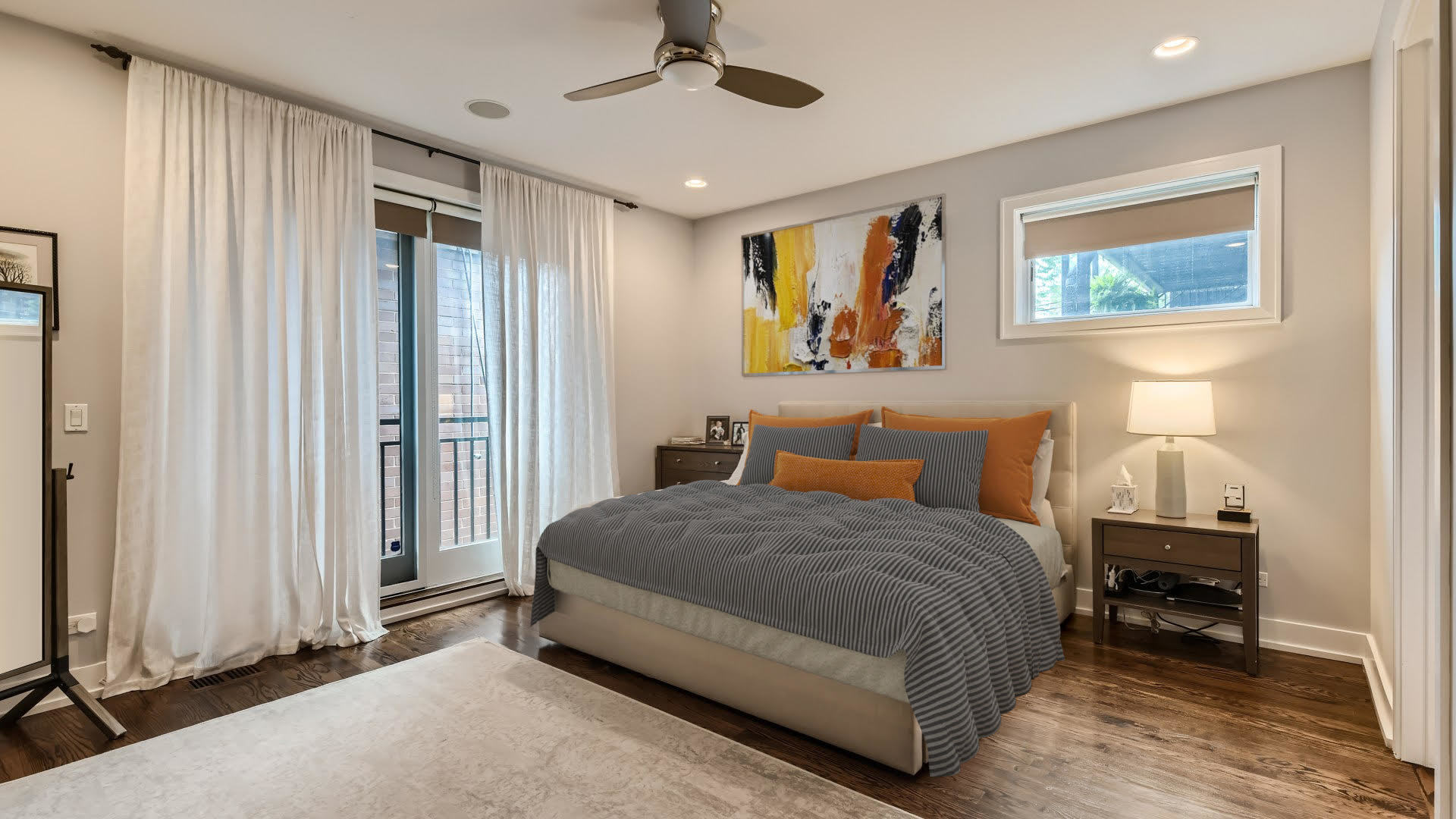 2144 West Rice Street, Unit 1E Chicago, IL 60622 - Photo 6 of 20 a bedroom with a bed a wall painting and a window