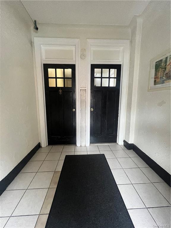 3179 Rochambeau Avenue Bronx, NY 10467 - Photo 3 of 7 Foyer entrance with light tile patterned floors
