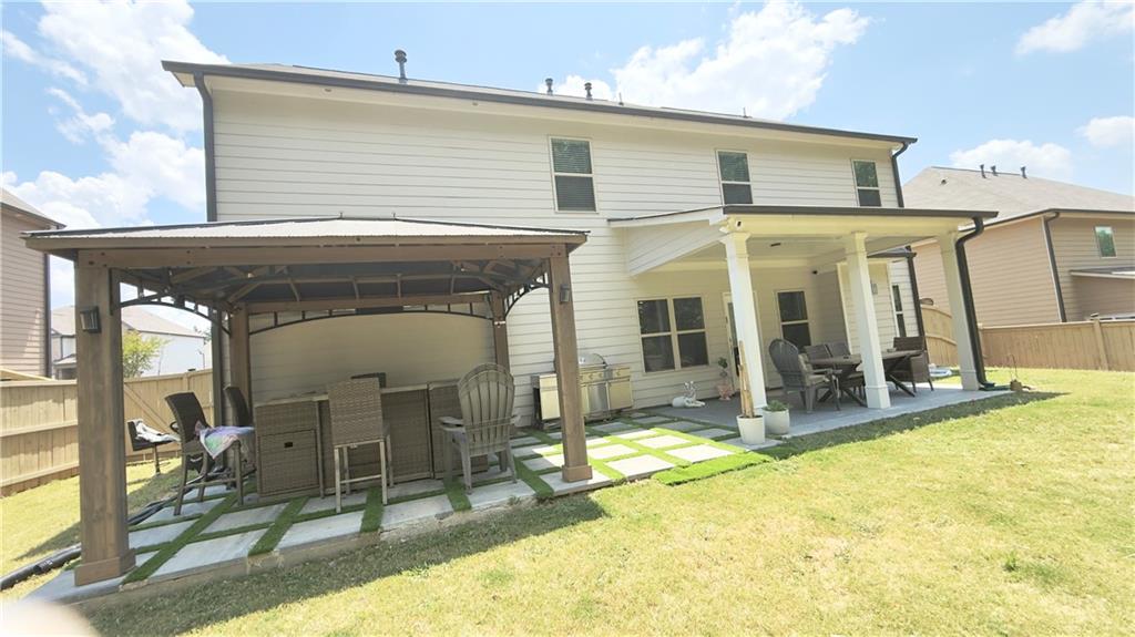 3370 Elkhorn Ridge Run Dacula, GA 30019 - Photo 28 of 29 a view of a house with patio