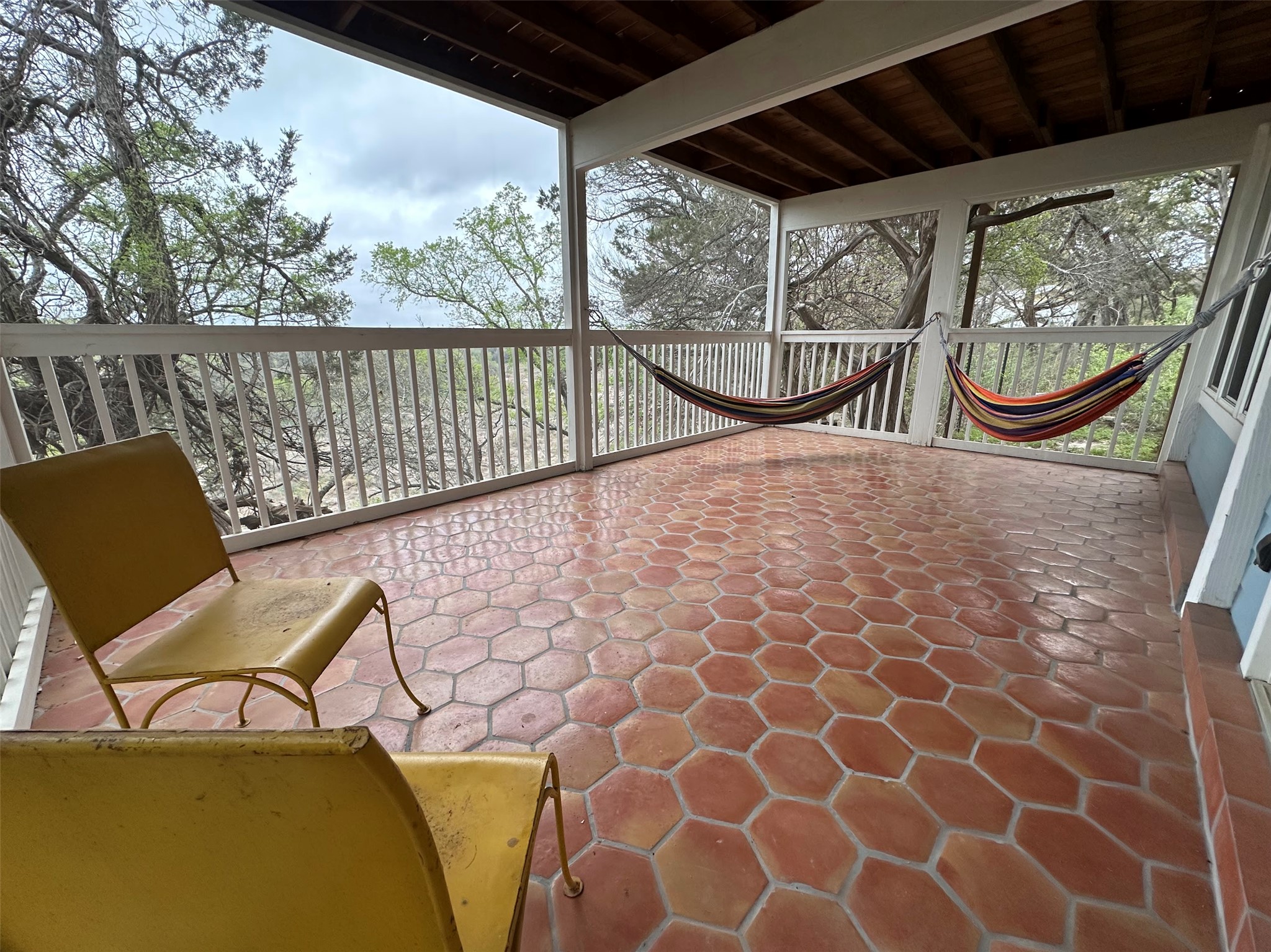 550 Cliffside Road Wimberley, TX 78676 - Photo 24 of 35 a view of a chairs and table in the balcony