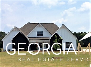 a front view of house with parking space